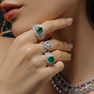 Gemma rings with white gold, emerald, and diamonds