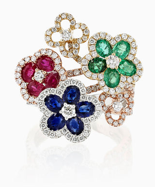 the Flora Bloom ring with white gold and rubies, emeralds, sapphires, and diamonds