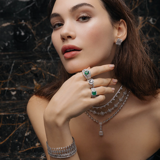 A woman wearing unique gemstone rings by Compositions