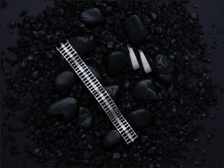 A diamond bracelet and diamond earrings by Compositions