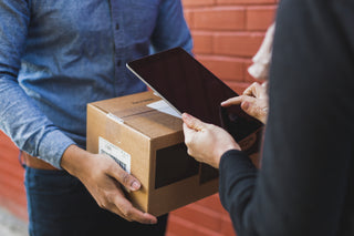 A person accepting a package delivery